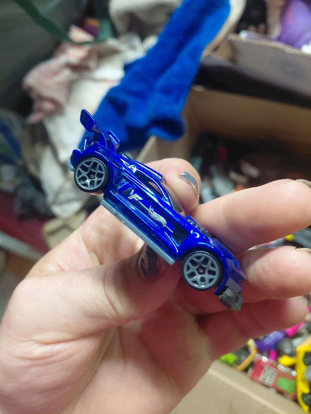 1:64 scale Hot Wheels Track Ripper in metallic blue